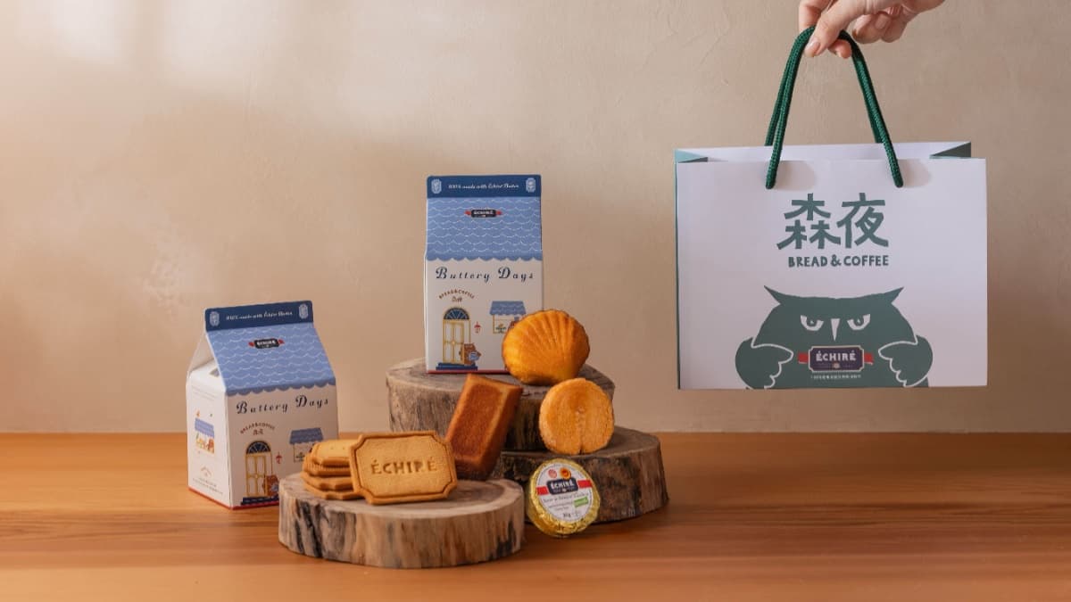 小禮盒結合小木屋、貓頭鷹插畫、奶油品牌。（圖片來源：森夜 Bread & Coffee）